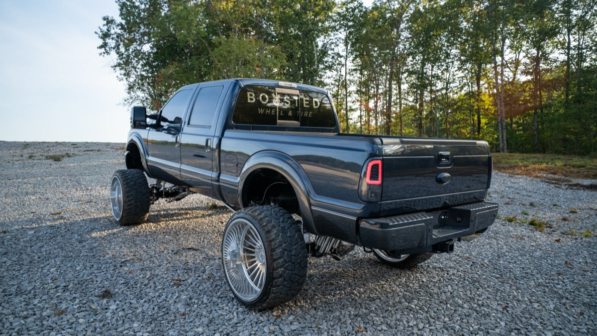 Rear three-quarter view of Blue Collar with the Boosted rear window decal
