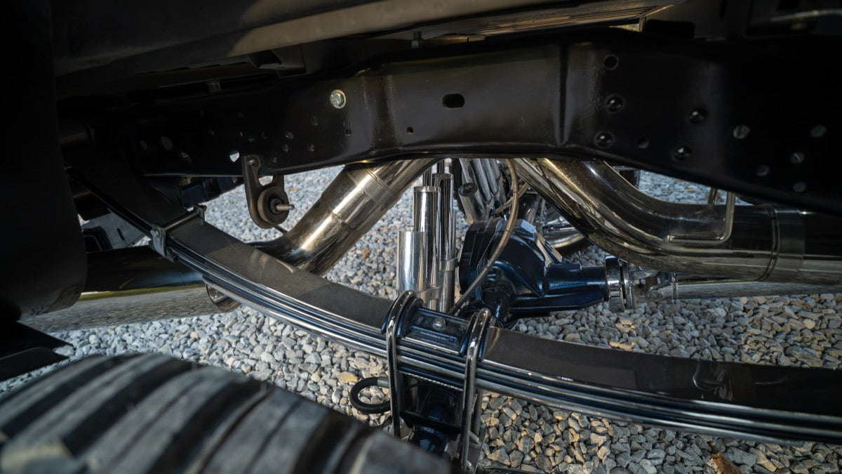 Undercarriage view of the stainless exhaust and rear suspension