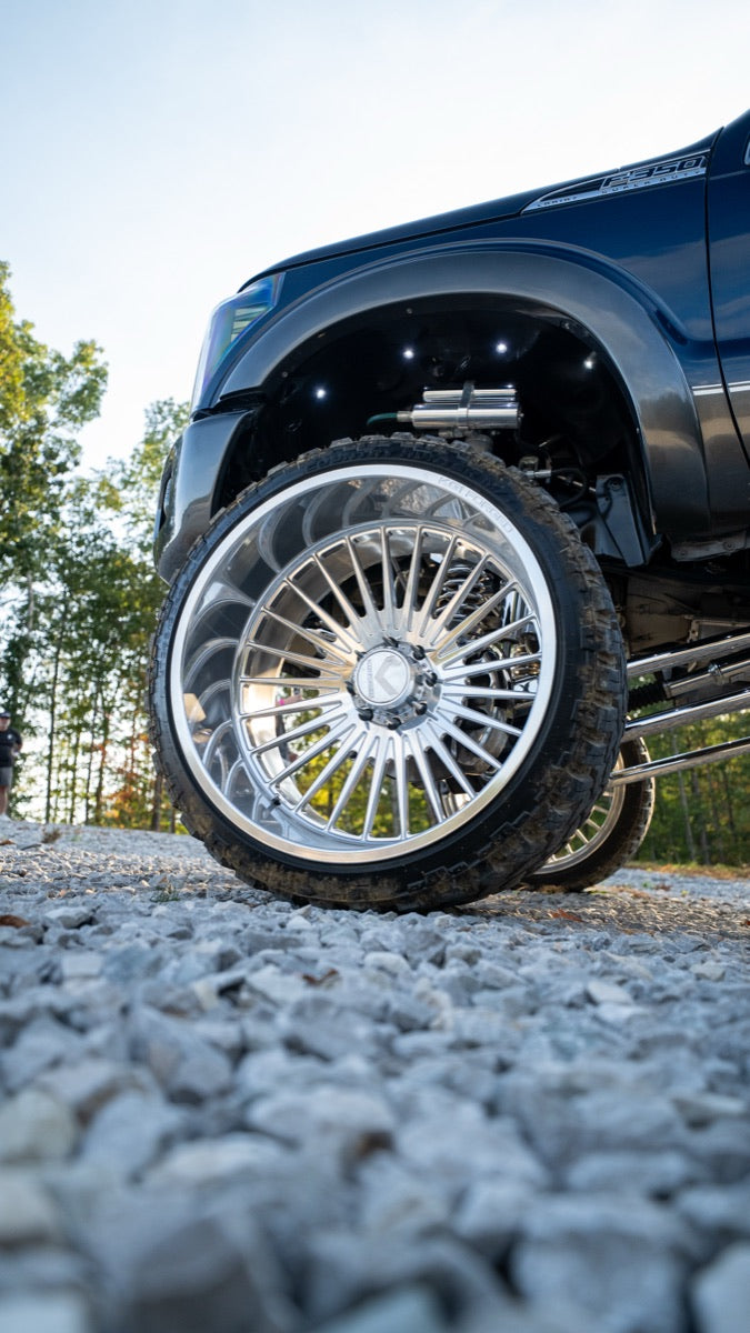 Polished wheel and tire sidewall from ground level